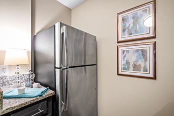 A kitchen with stainless steel appliances at 701 south apartments in mobile, al